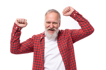 handsome 60s retired man with white beard and mustache rejoices