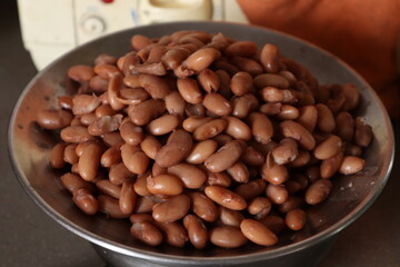 Boiled brown Rajma or Boiled Kidney beans in A Steel plate with selective Focus 