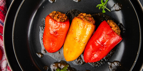 pepper stuffed meat stuffing bell pepper paprika pork, beef, chicken meat meal food snack on the table copy space food background rustic top view 
