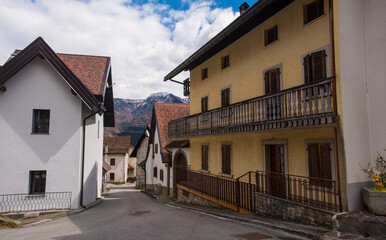 Fototapeta na wymiar A street in the mountain village of Mione in Carnia, Friuli-Venezia Giulia, north east Italy
