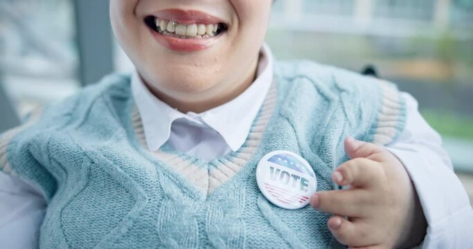 Vote, politics and a woman with a disability pointing to a badge in support of freedom, democracy or choice. Mouth, wheelchair and smile for decision or selection of political party in an election