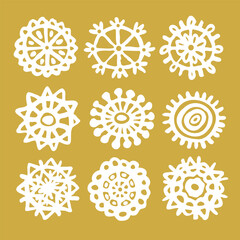 Snowflakes drawn in childish style linear icons set on golden