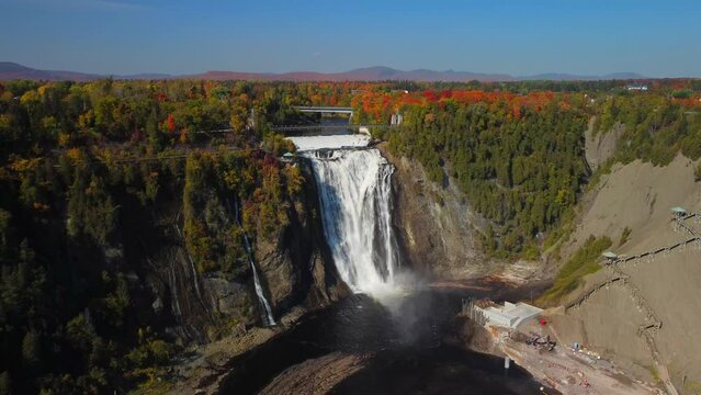 Drone landscape footage of Montmorency Falls with forest trees in Quebec, Canada