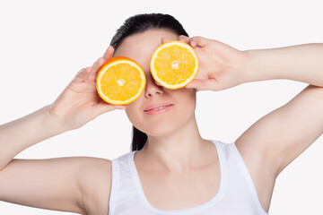 Young happy woman with oranges on isolated background. 