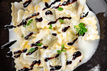 ravioli cheese meat cream sauce pasta meal food snack on the table copy space food background rustic top view