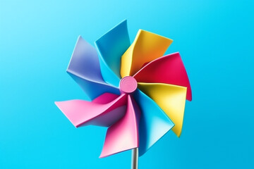 Vibrant colorful  pinwheel on blue background.