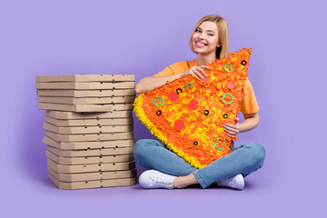 Full body photo of sitting floor young woman eating pizza slice italian pepperoni delivery carton...