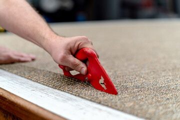 Cutting carpet with a knife