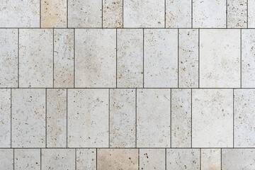 texture of a tiled beige stone wall as background, natural stone wall texture as background....