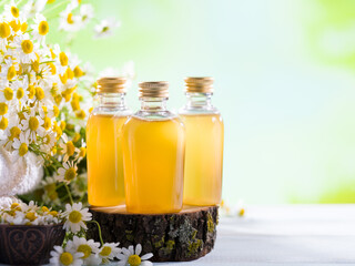 Chamomile oil or broth. Aromatic vegetable oils for hair and body care. 