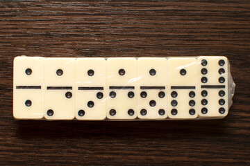 Dominoes bones in plastic wrap