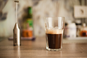 Coffee in the glass on the kitchen table 