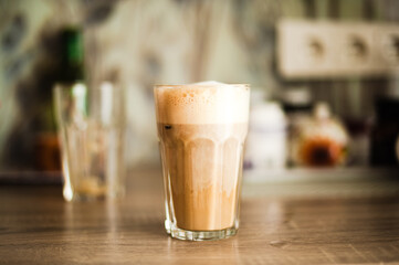 glass of latte on table