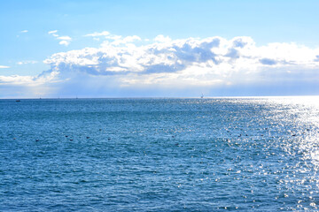 Sea view on a sunny day. Seascape. Sky with clouds