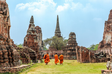Monks walking beside a temple in Ayuttaya