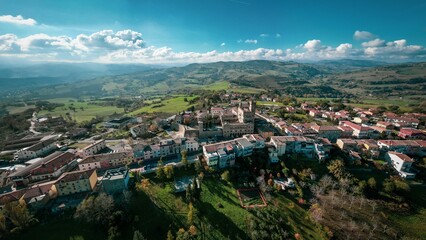 Fototapeta na wymiar Aerial shot of the beautiful buildings of the medieval Tavoleto village in Italy on a sunny day