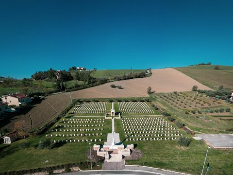 Aerial of the English war cemetery in Montecchio Italy with the blue sky in the background