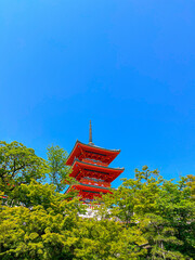 Japanese red pagoda. Blue cloudy sky. Temple roof. Oriental architecture. 