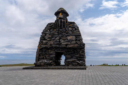 Arnarstapi , Iceland - July 1, 2023: The Bardur statue created by Ragnar Kjartansson. Based on an ancient saga of Bardur, who was half man and half troll, on the Snaefellnes Peninsula
