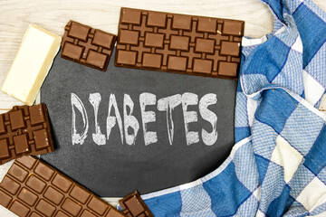diabetes concept on chalkboard with chocolates bars 