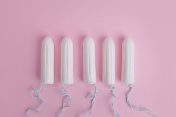 Hygienic female tampon on a pink background