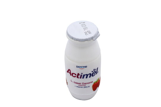 Actimel yoghurt with strawberry taste. Close up and isolated on a white background.