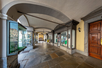 Cuneo, Piedmont, Italy - August 16, 2023: view of typical arcades under historic buildings with...