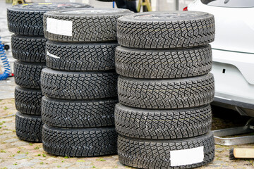 Obraz premium Sets of new high performance gravel rally tires, closeup of modern asymmetric tread pattern