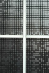 Vertical shot of a black and white tiled wall in Korea