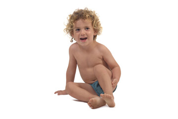 boy sitting o floor on white background