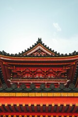 Vertical shot of a red historic shrine in Japan