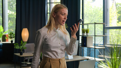 Fototapeta premium Annoyed mad angry businesswoman employer manager woman Caucasian girl talk mobile phone in office arguing business conversation stress trouble problem shout quarrel scream loud voice smartphone call