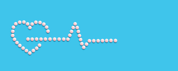 A group of pink round pills form a figure on a blue background. Pulse. The theme of healthcare, treatment and prevention of diseases. World Heart Day