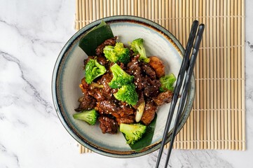Overhead view of a delicious meal of Mongolian beef and broccoli served in a bowl