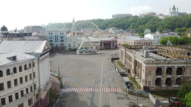 Abandoned street during pandemic lockdown, Ferris Wheel on Podil in Kyiv, Ukraine