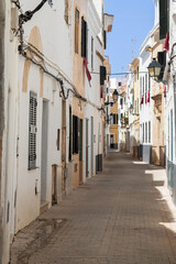 Narrow alley in the old town of Ciutadella de Menorca in Spain.