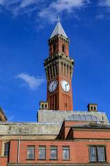 Vertical of Old Joe monument against blue sky in Birmingham, England