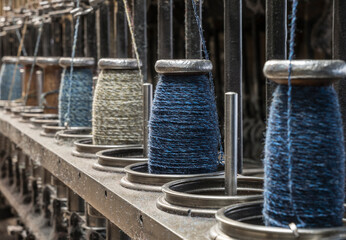 string spools of a historic  weaving machine