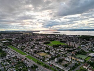 Aerial view of a historic cityscape of Edinburgh in Scotland at sunset