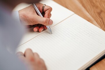 businessman writing some bullet points on a paper