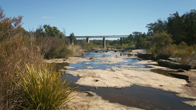 View of the Quart Pot Creek Rail Bridge with forest trees in Stanthorpe, Australia