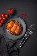 Delicious dolma in tomato sauce with carrots, onions, salt, spices and herbs