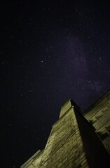A house against the background of a dark night starry sky