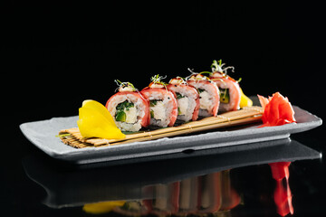 Tuna Dragon sushi with tuna, tiger shrimp, cream cheese, cucumber, tobiko caviar, Spicy sauce,...