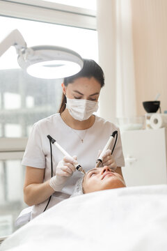 Doctor works with patient in dermatology clinic