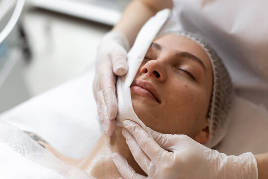 Doctor works with patient in dermatology clinic