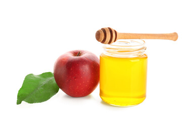 Jar of honey and apple for Rosh Hashanah celebration (Jewish New Year) on white background