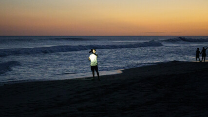 Boy with cam on the beach 