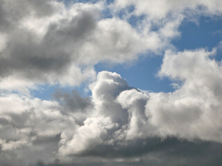 Obraz premium White clouds over blue sky background. Fluffy cumulus cloudscape
