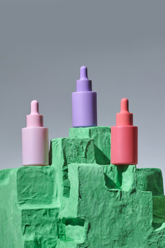 Skincare cosmetic jar on green concrete hill mockup
